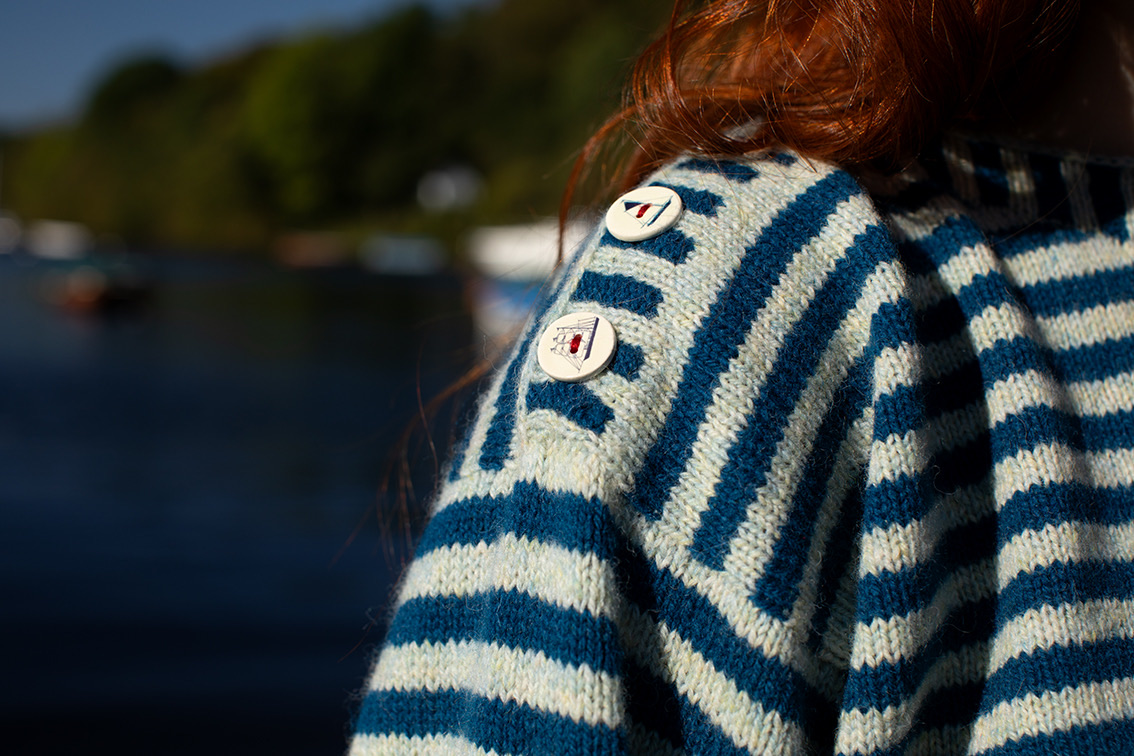 Jade Starmore knitwear featuring ceramic buttons with boat designs