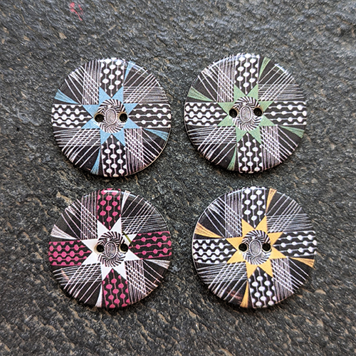 Ceramic buttons featuring a corsage design. 